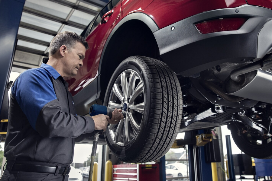 Ford Technician Servicing Tires