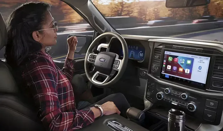 woman inside of Ford F-150